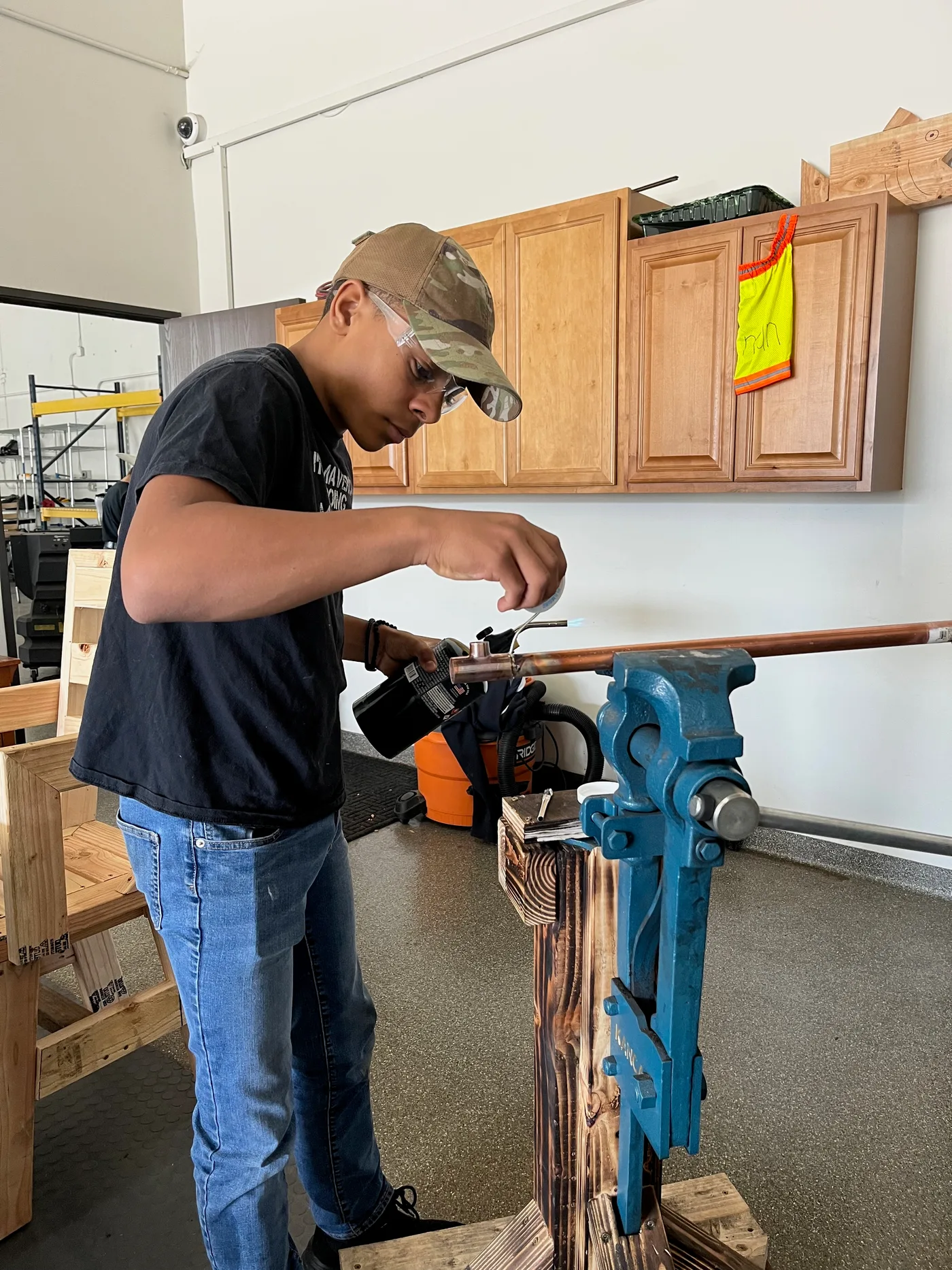 Student using a workshop vise during a CTA class